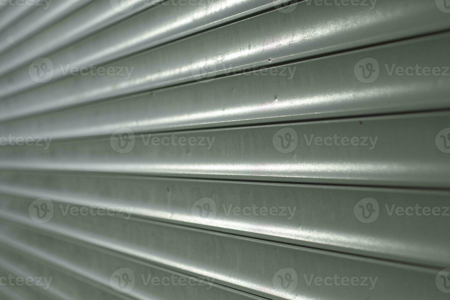 Blinds on window. Plastic shutters. Ribbed surface. photo