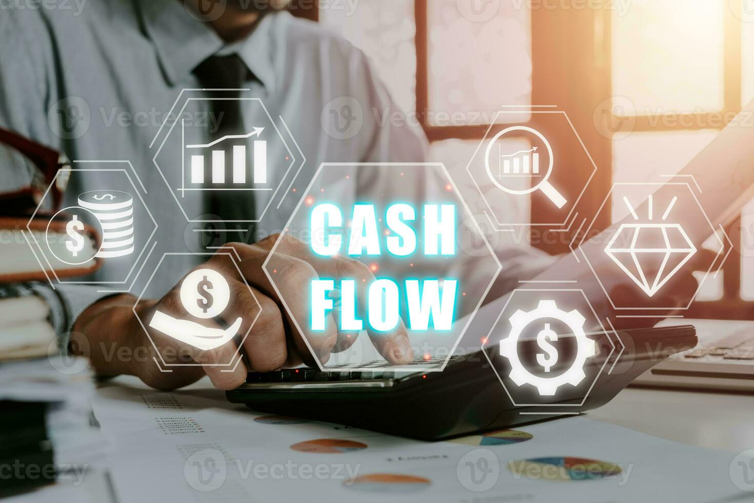 Cash flow concept, Businessman using calculator and analyzing business charts on office desk with cash flow icon on virtual screen. photo