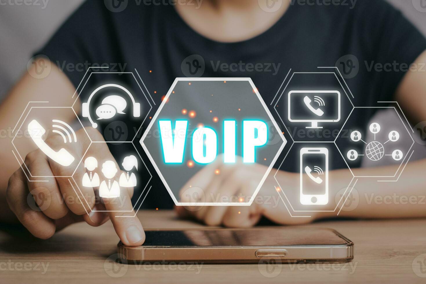 VoIP, Voice over IP Telecommunication concept, Business person hand using smartphone with VoIP icon on virtual screen. photo