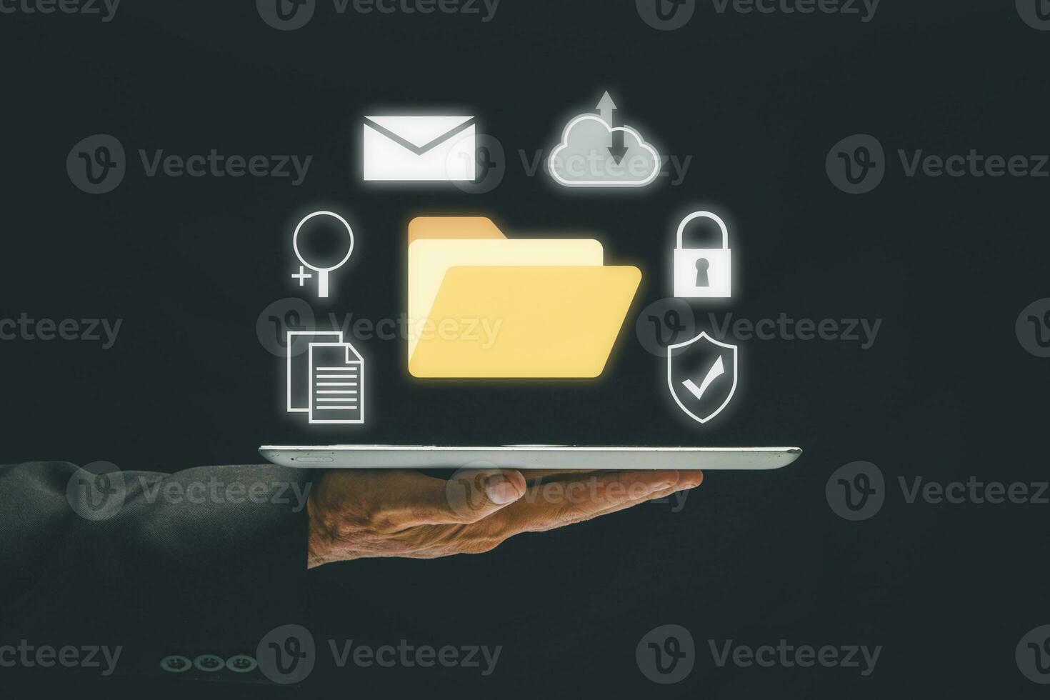Document Management System, Business hand holding tablet with folder and document icon on virtual screen. .Software for archiving, searching and managing corporate files and information. photo