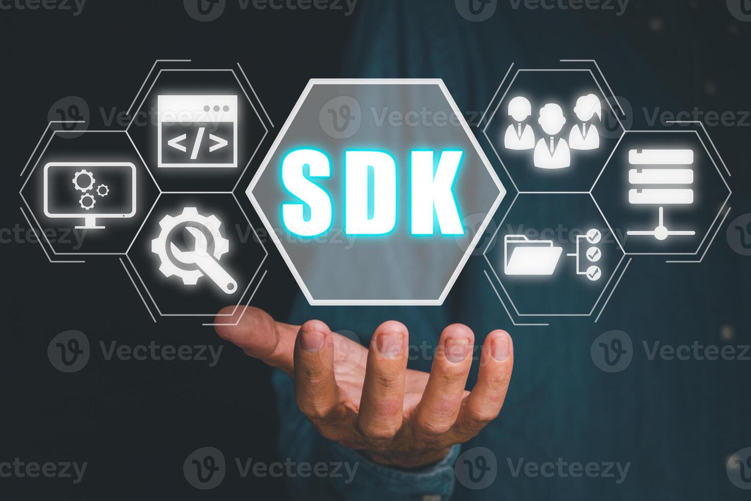 SDK - Software development kit programming language technology concept, Person hand holding SDK icon on virtual screen. photo