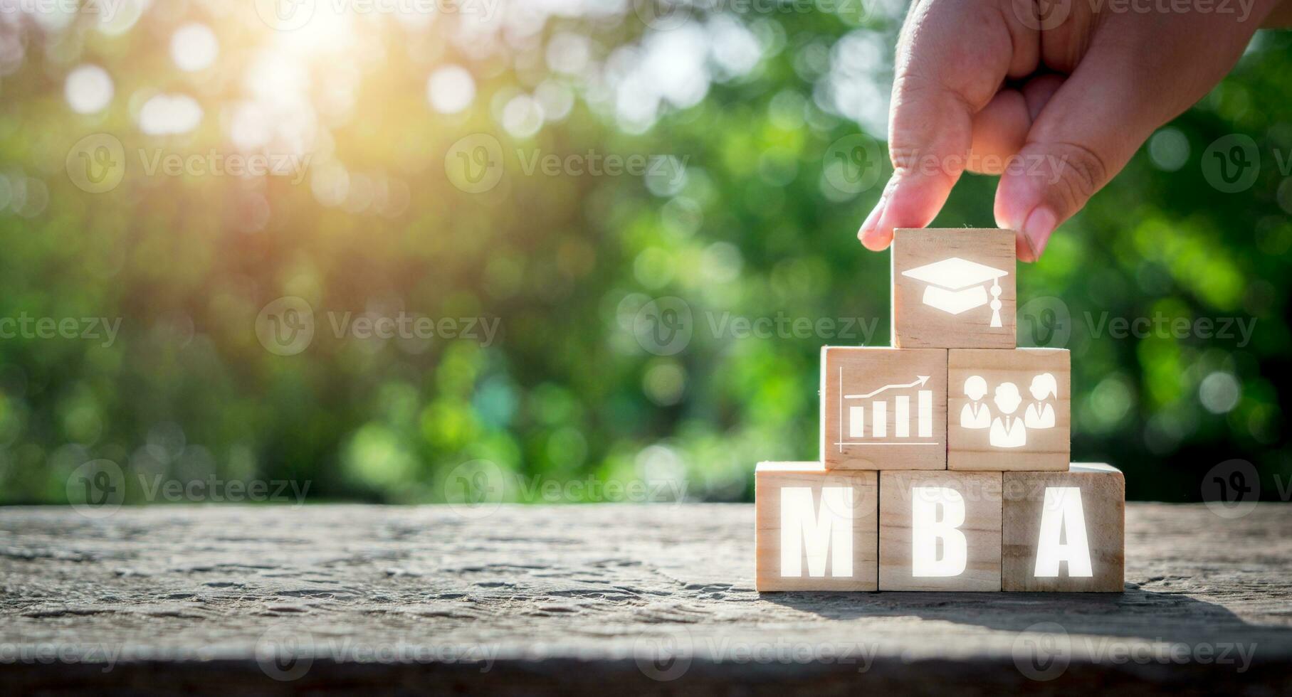 MBA, Master of business administration Education concept, Hand holding wooden block with Master of business administration icon on virtual screen. photo