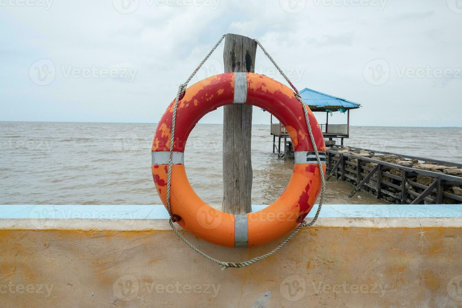 selectively focus on the red lifebuoy, used for emergency situations when someone is drowning photo