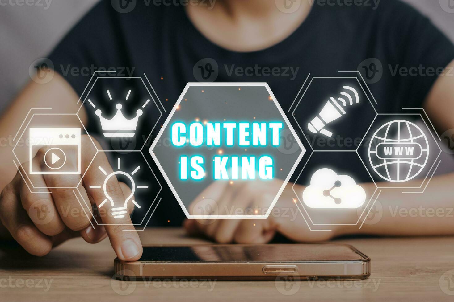 Content is king Concept, Person using smat phone on desk with content is king icon on virtual screen. photo