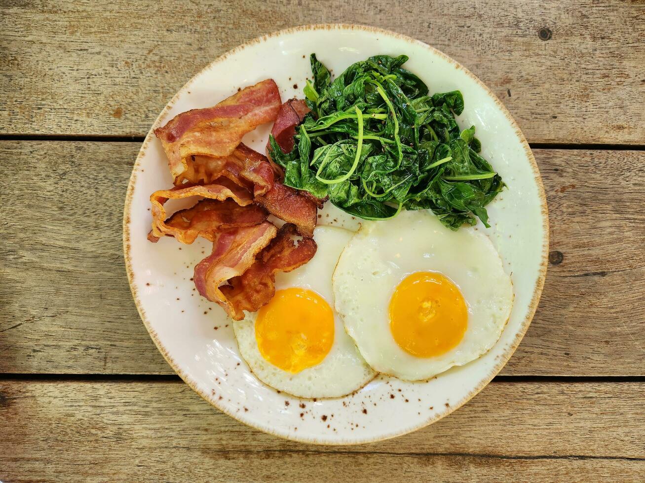 American breakfast top view on wooden table background. photo