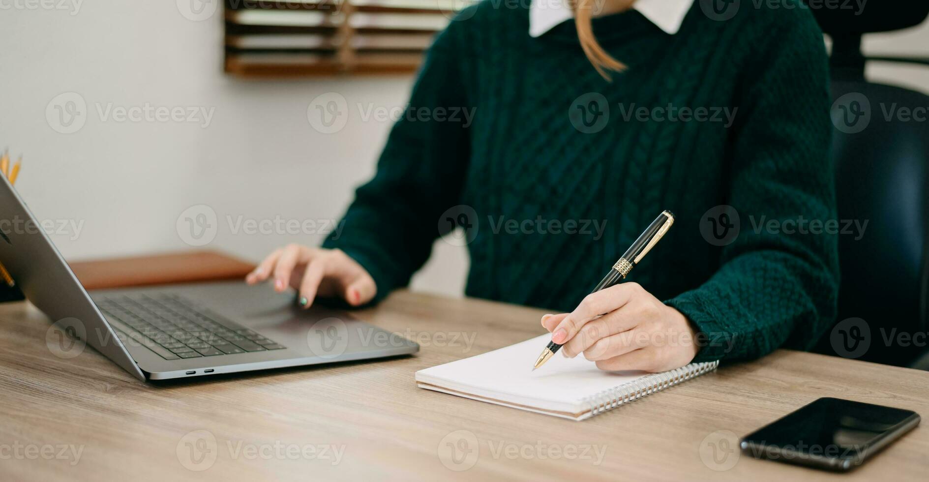 businesswoman hand working with new modern computer and writing on the notepad strategy diagram as concept morning light photo