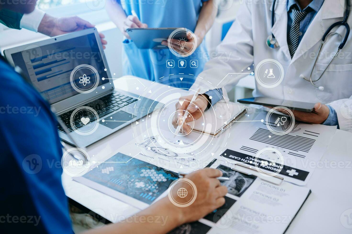 Medical technology network team meeting concept. Doctor hand working with smart phone modern digital tablet and laptop computer with graphics chart interface, with virtual icon photo