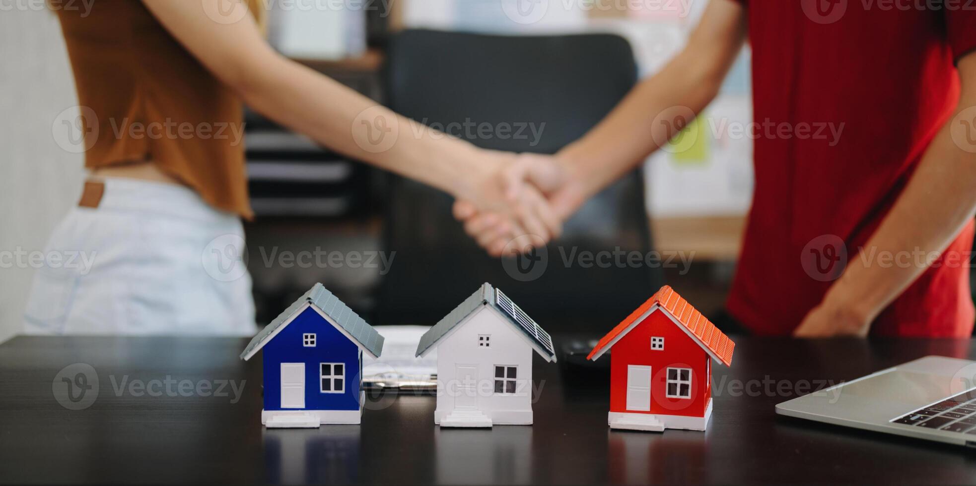 Signing a contract. Client and broker agent, lease agreement, successful deal and  Young business sitting at the desk photo
