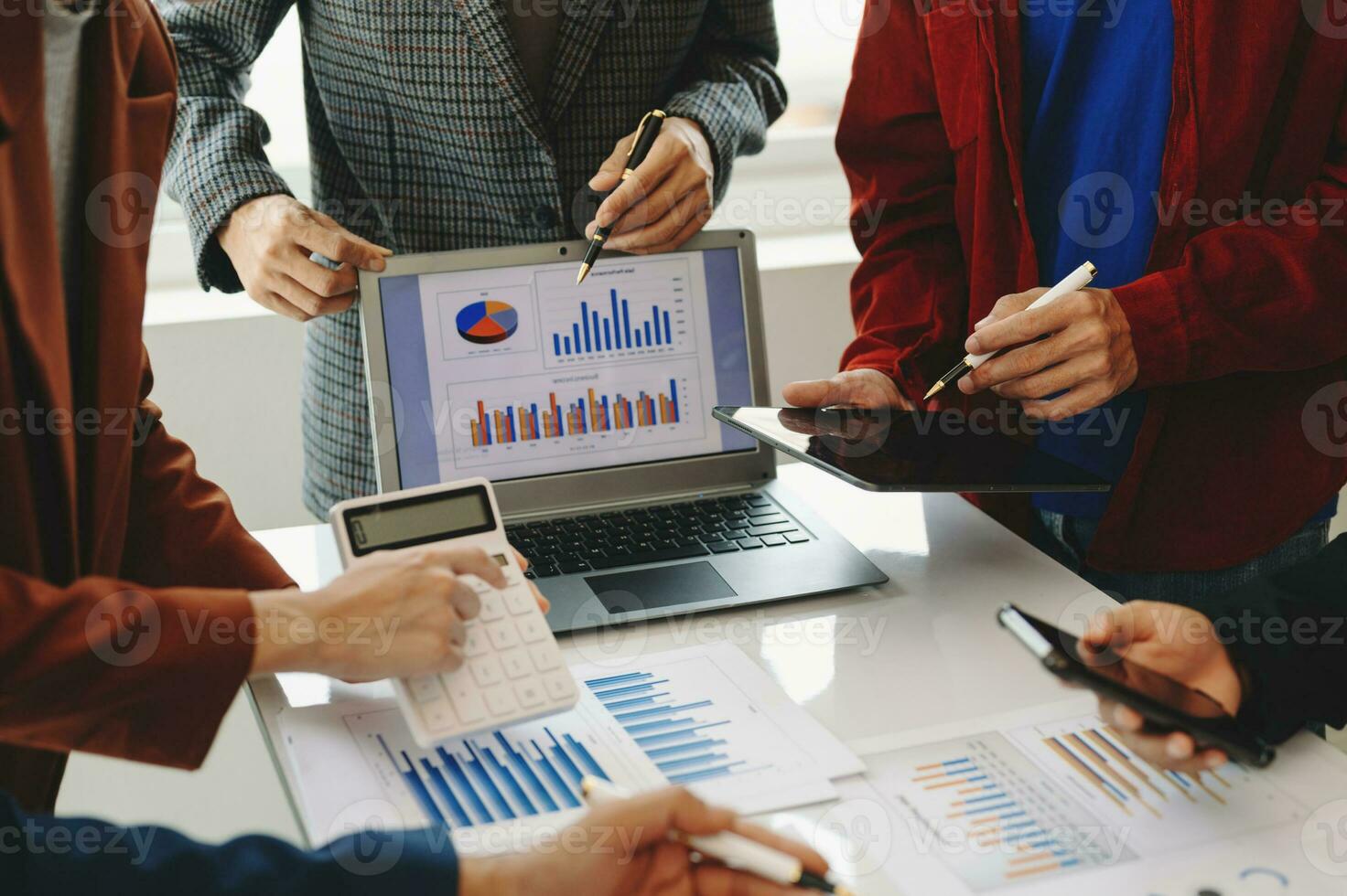 Business team meeting present.professional investor working with  Finance managers task. with laptop smart phone and digital tablet in morning light photo