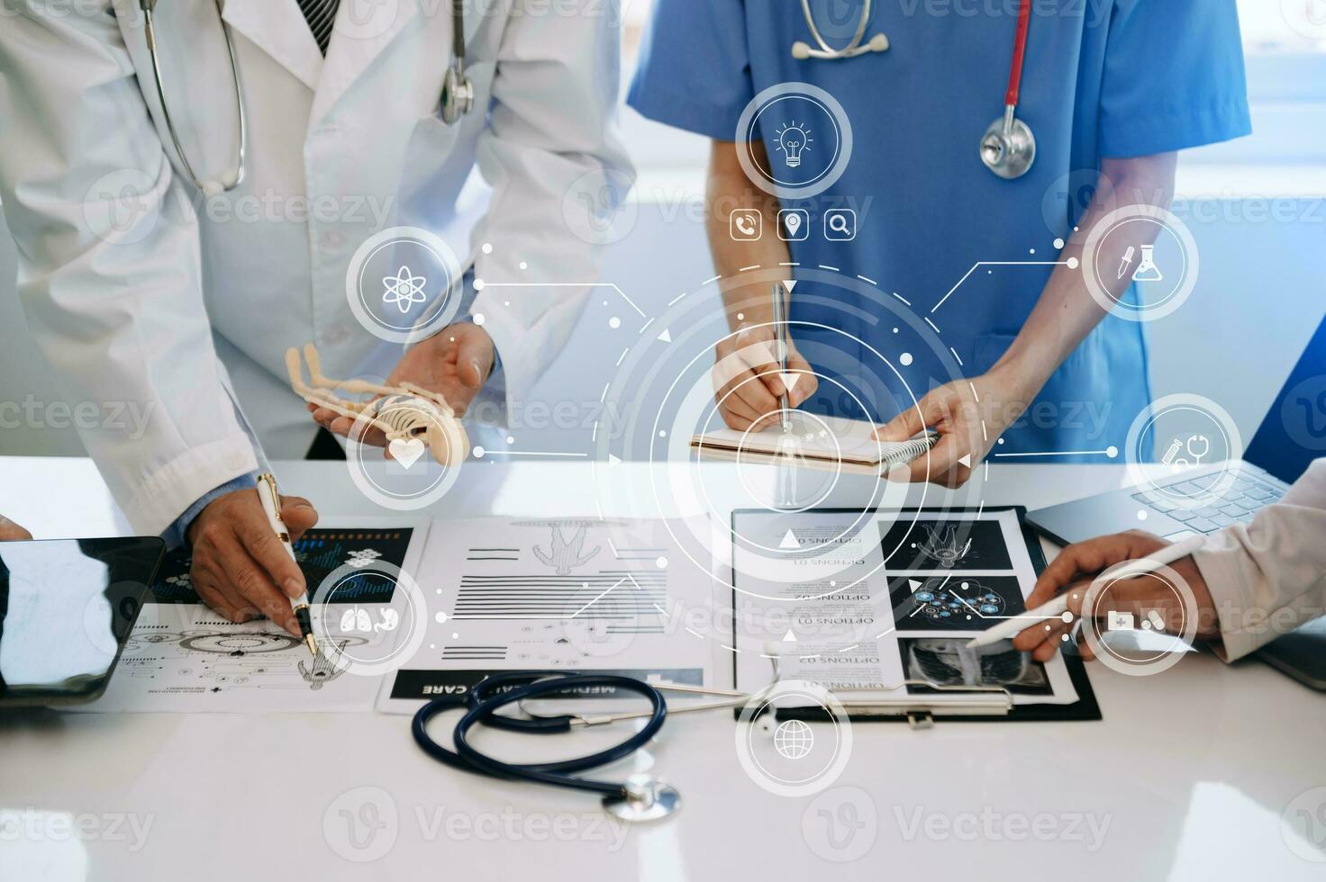 Medical technology network team meeting concept. Doctor hand working with smart phone modern digital tablet and laptop computer with graphics chart interface, with virtual icon photo