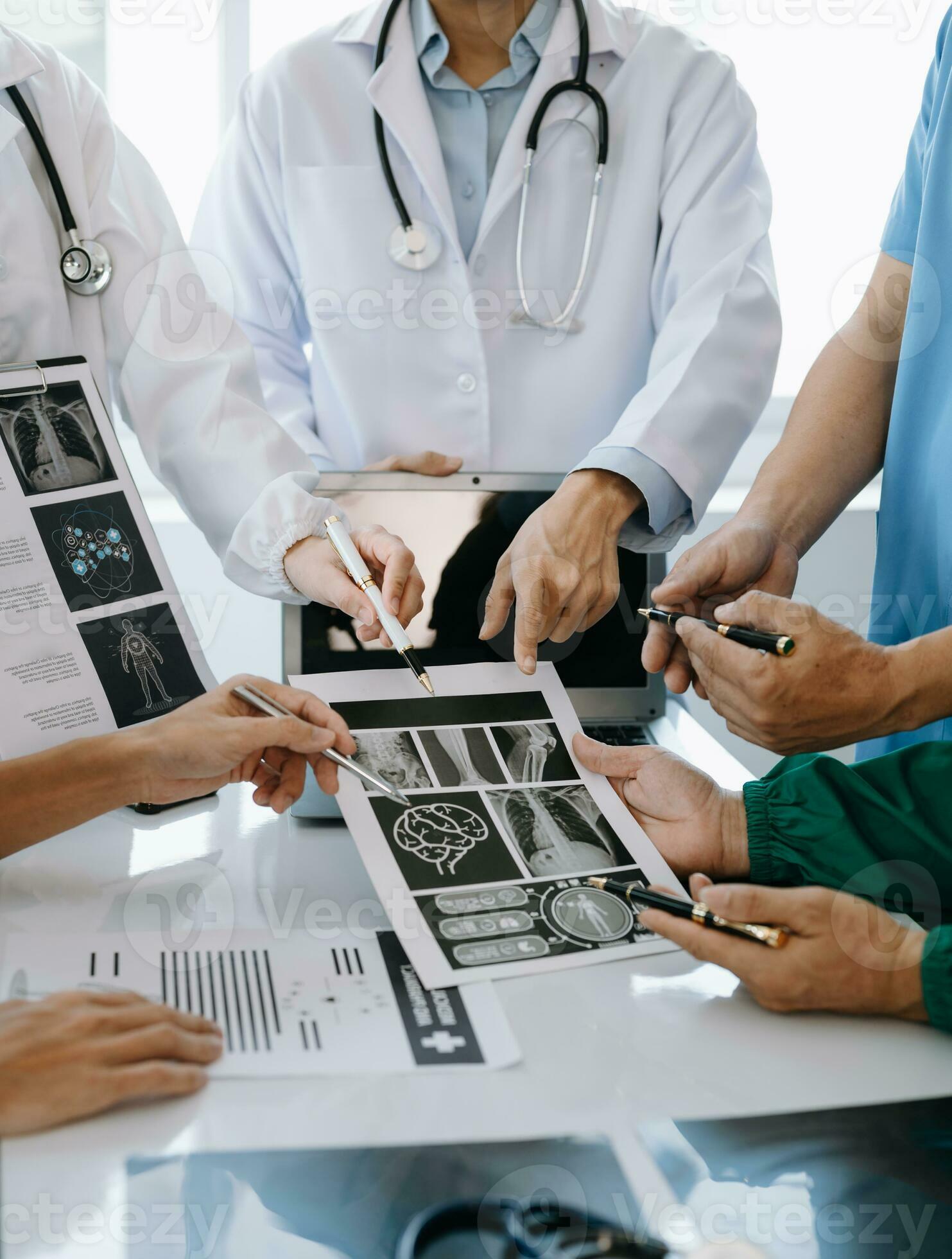 Medical team having a meeting with doctors in white lab coats and