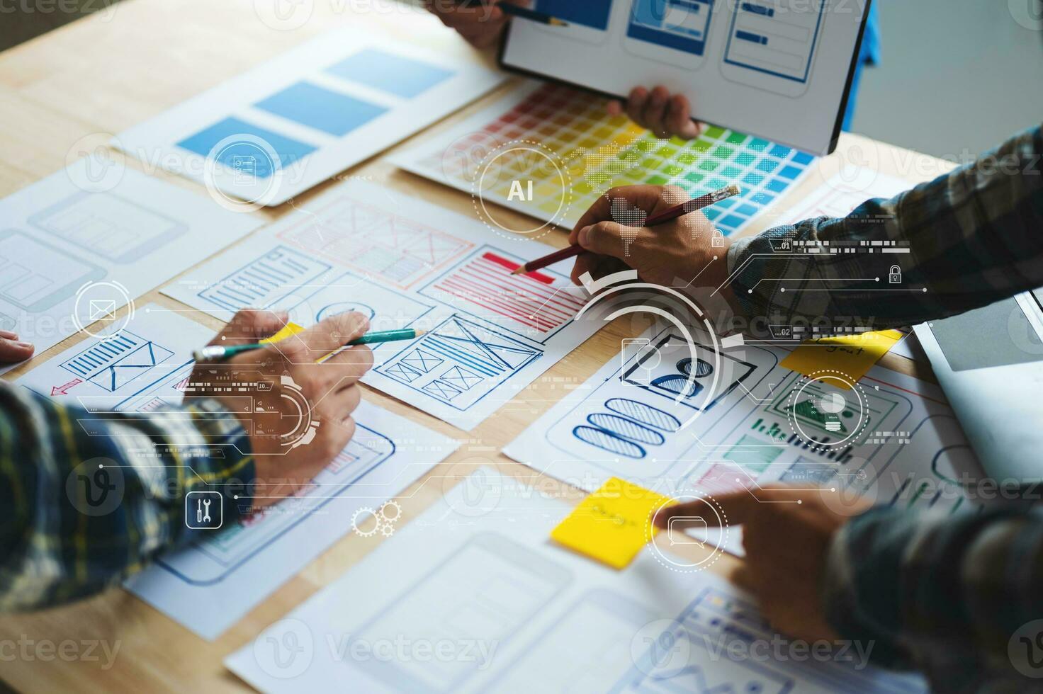 UX developer and ui designer brainstorming about mobile app interface wireframe design with customer breif and color code at office. with virtual icon photo