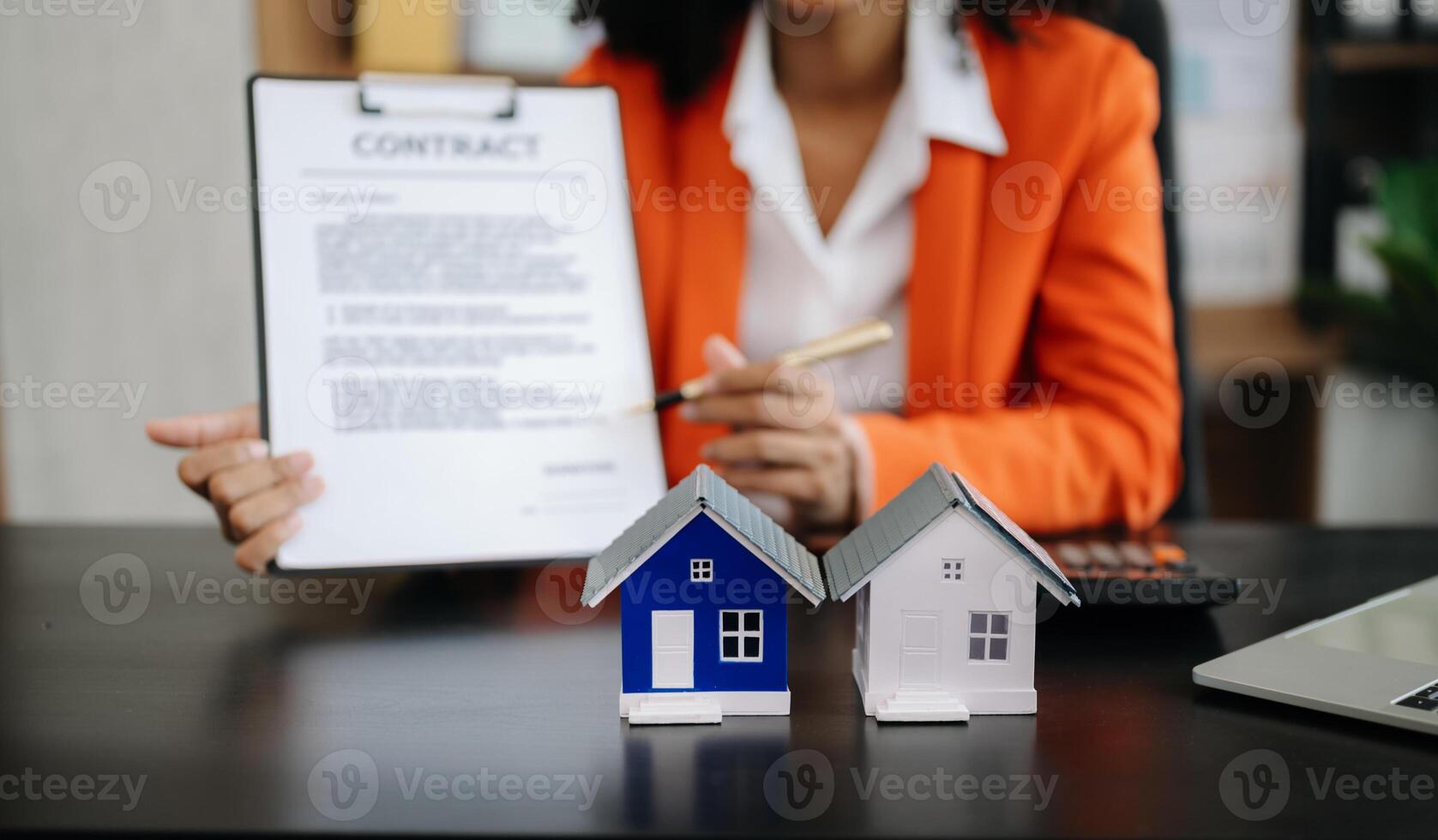 Signing a contract. Client and broker agent, lease agreement, successful deal and  Young business sitting at the desk photo