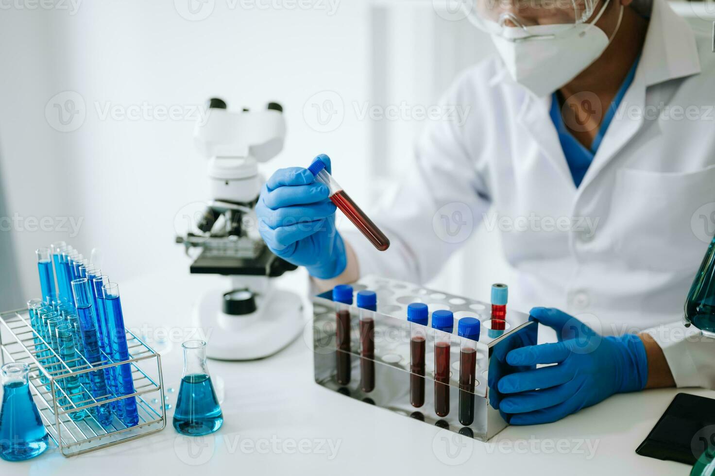 Male scientist researcher conducting an experiment in laboratory. photo