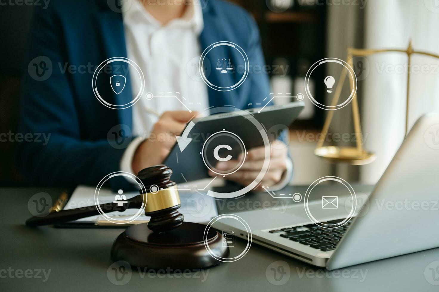 Copyright or patent concept, Person hand using laptop computer, tablet and smartphone with virtual screen copyright icon trademark, Creation ownership against piracy. at office photo