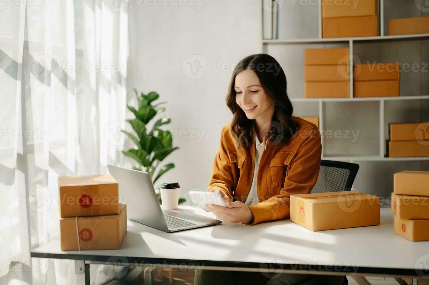 Beautiful Asian lady blogger showing clothes in front of the camera to recording vlog video live streaming photo