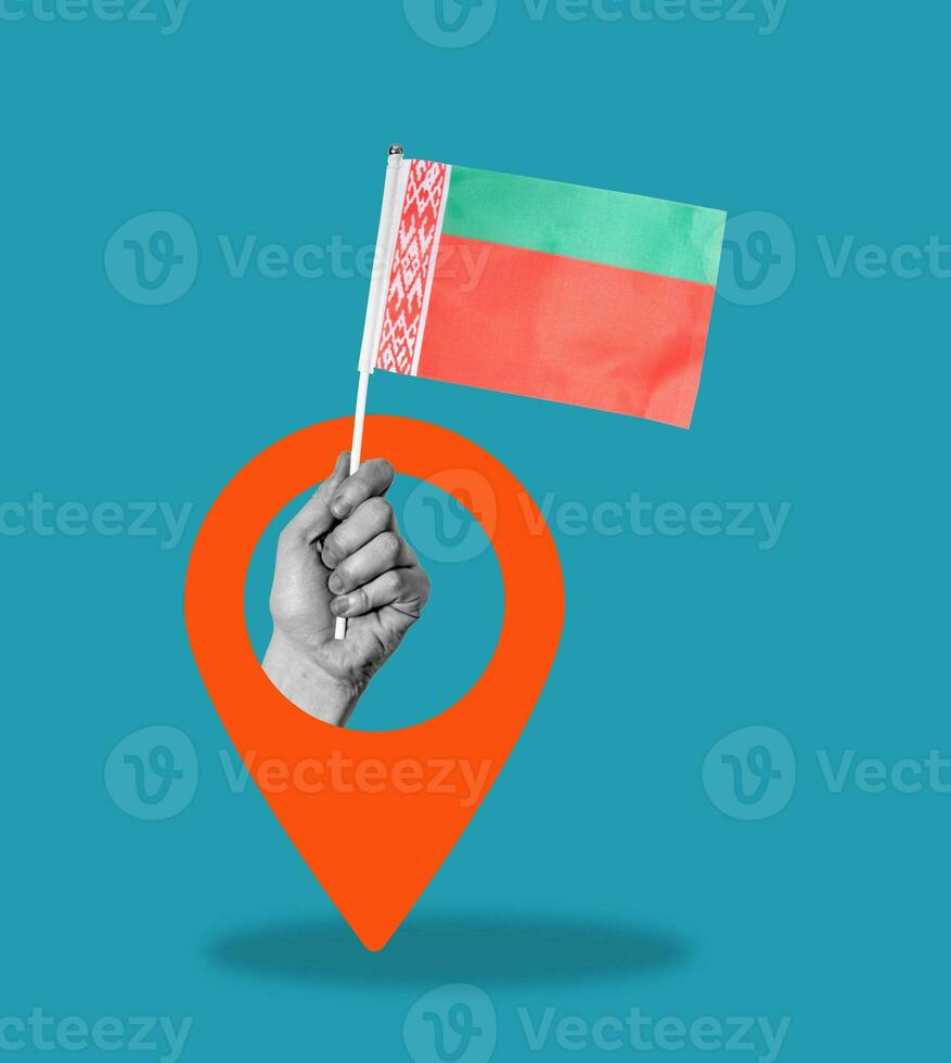 Art collage, Hand with the Belarusian flag and navigation icon on a blue background. photo