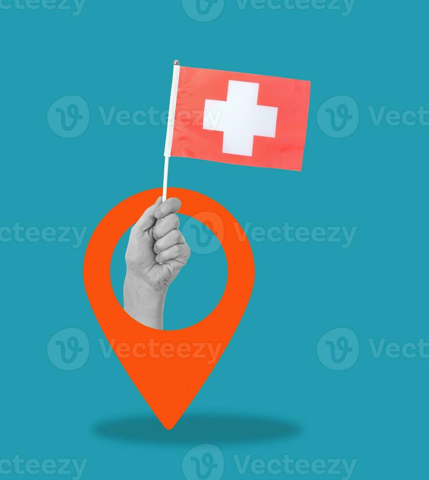 Art collage, Hand with Swiss flag and navigation icon on blue background. photo