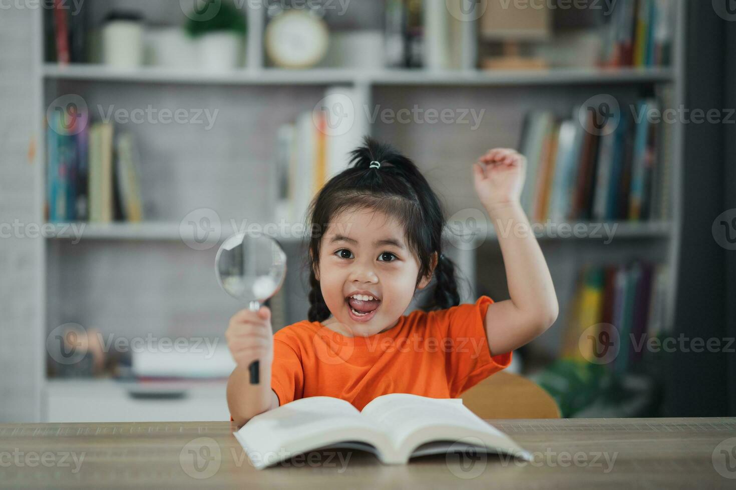 Asian baby kid girl holding magnifying glass and raise your hand reading  book education, children and school concept - happy smiling student girl learning  studying. Education development concept. 24965473 Stock Photo at Vecteezy