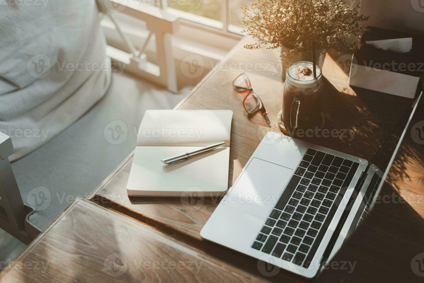 View of portable workspace with laptop on the table in co-working space. Conceptual workspace,Empty space desk white with on Laptop computer screen. photo