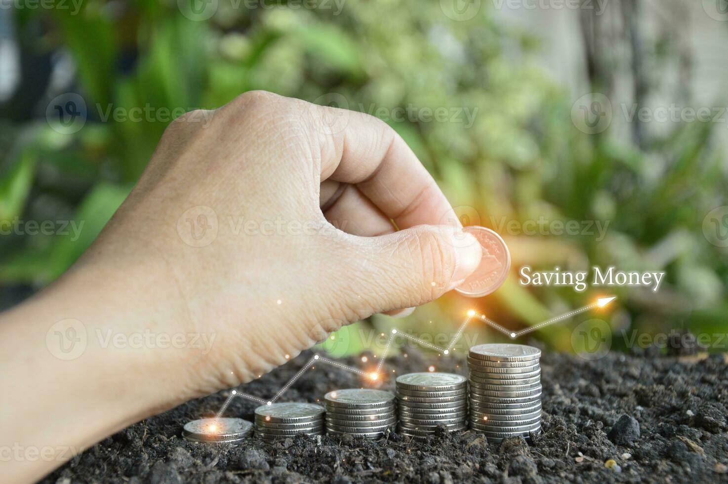Businessman holding stacks of coins Money Savings Concepts for Financial Accounts photo