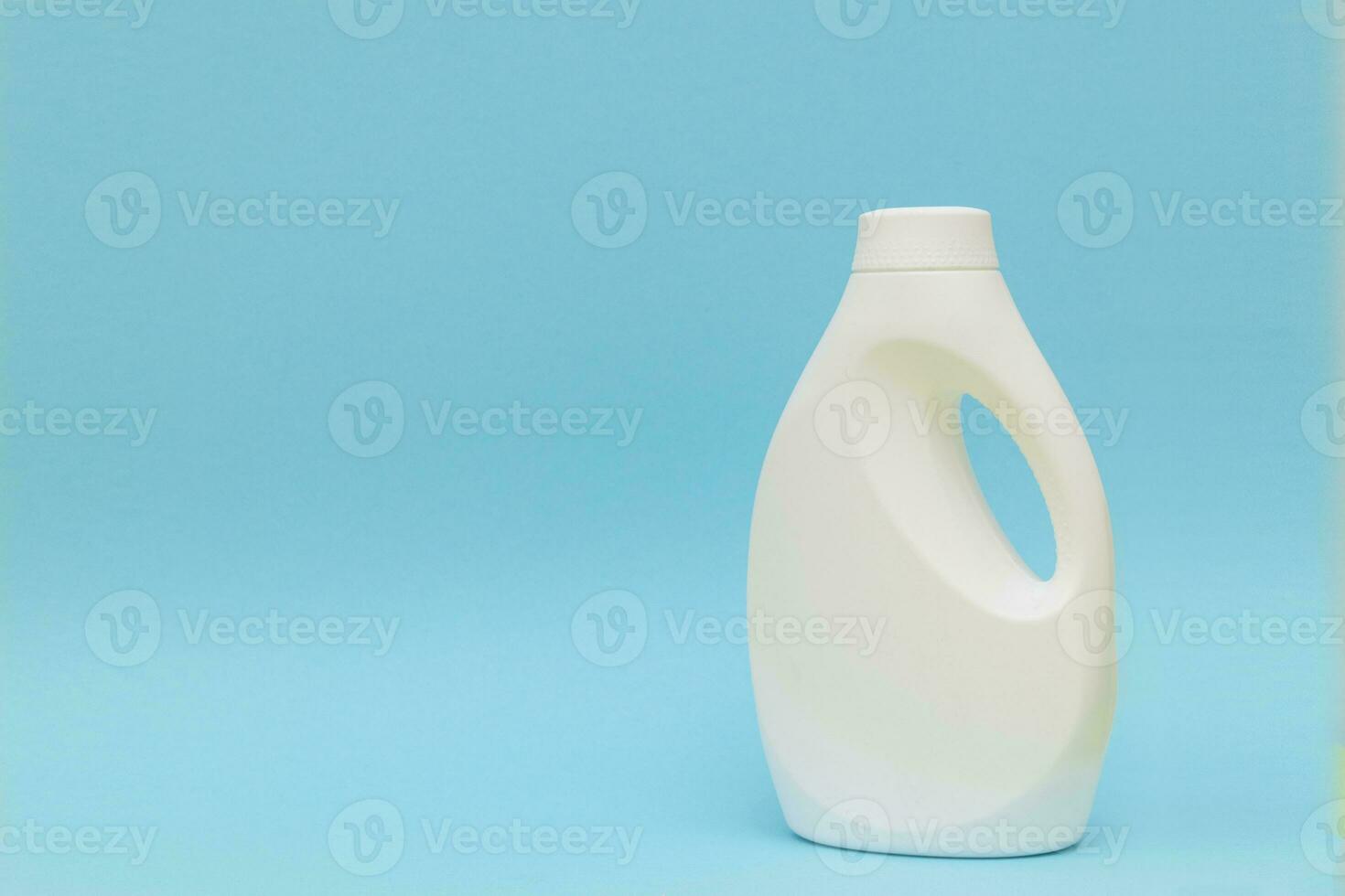 white plastic container on blue background. Powder bottle mockup photo