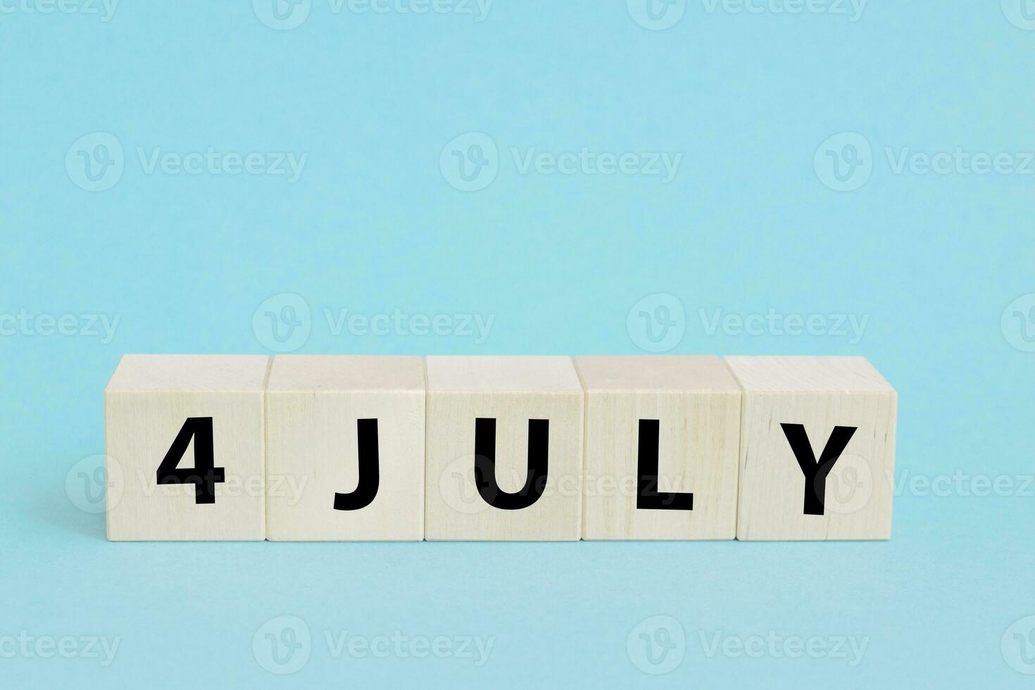 4th of July American Independence Day. Happy Independence Day. Wood cubes with lettering photo