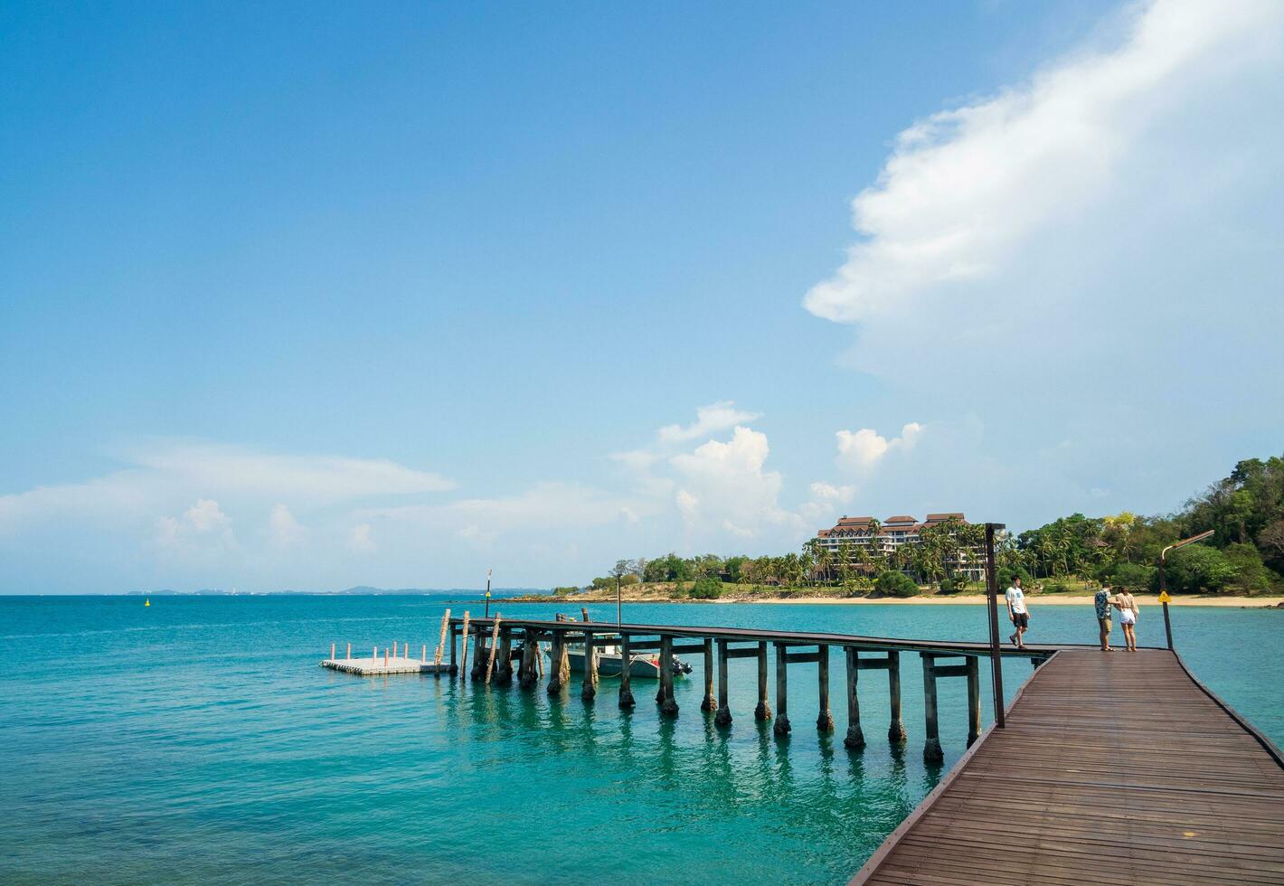 Landscape summer walkway bridge walk sea and also small port. And small boat moored with view of blue sea, clear sky clean, suitable holiday travel At Gulf Thailand Khao Leam Ya National Park Rayong photo