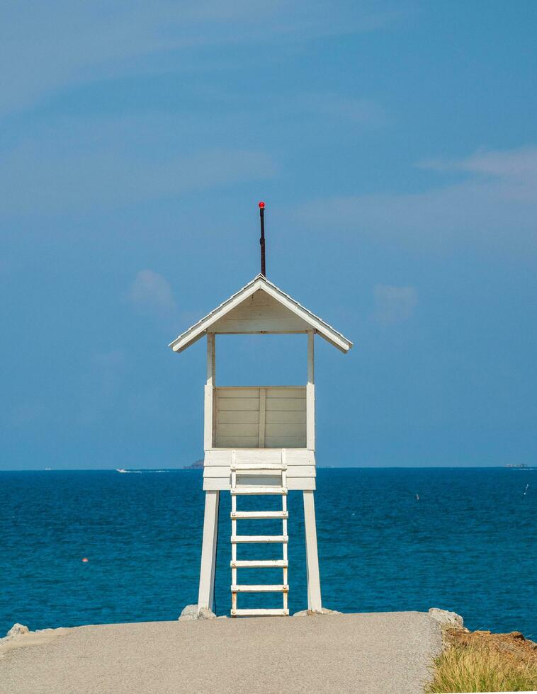 Landscape summer panorama tropical wooden lighthouse sea beach rock blue sky calm Nature ocean Beautiful wave crash splashing water travel Nang Ram Beach East thailand Chonburi Exotic horizon photo