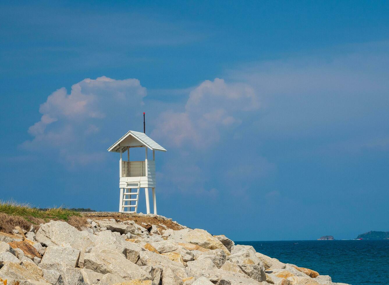 Landscape summer panorama tropical wooden lighthouse sea beach rock blue sky calm Nature ocean Beautiful wave crash splashing water travel Nang Ram Beach East thailand Chonburi Exotic horizon photo