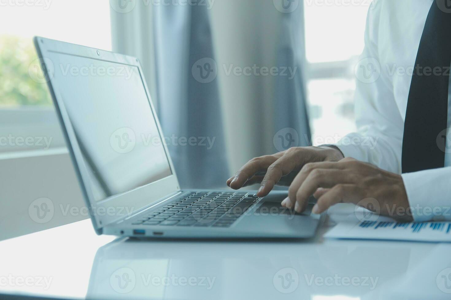 Close up businessman hand using calculator and working with laptop calculate about finance accounting at coffeeshop outdor.finance accounting concept photo