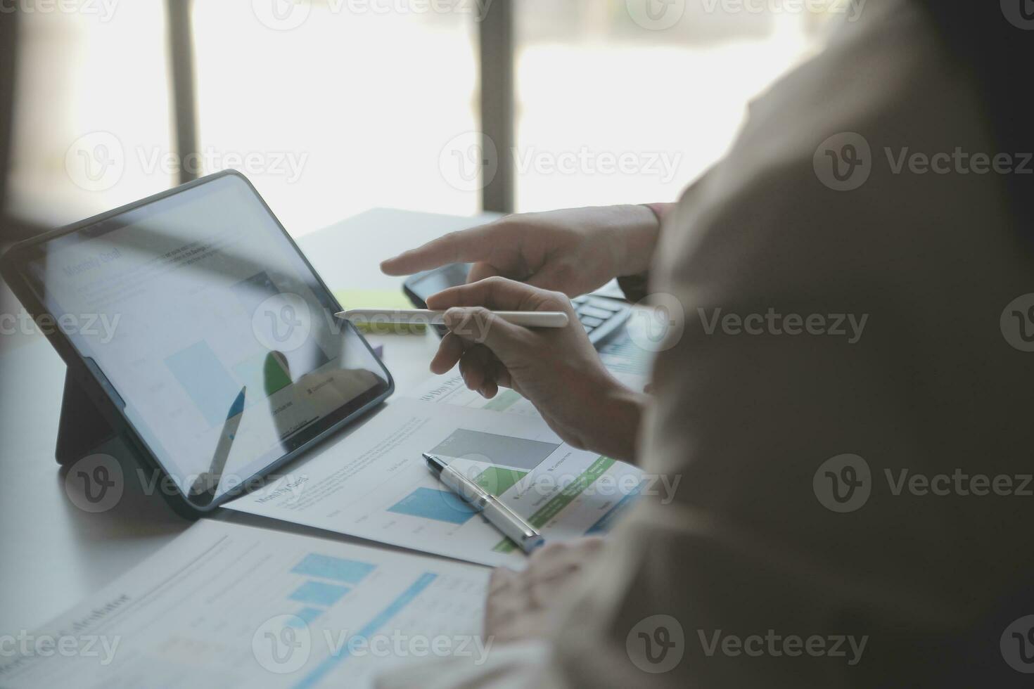 Audit concept,Administrator business man financial inspector and secretary making report calculating balance. Internal Revenue Service checking document. photo