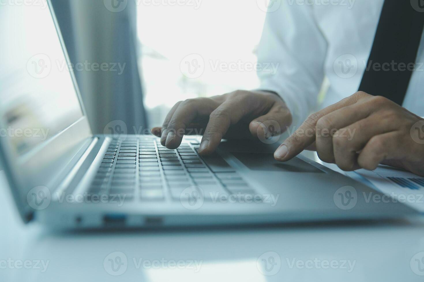 Close up businessman hand using calculator and working with laptop calculate about finance accounting at coffeeshop outdor.finance accounting concept photo