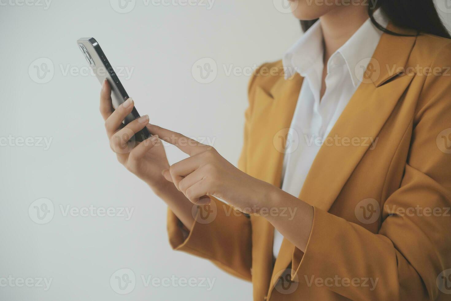 Asian Business woman using calculator and laptop for doing math finance on an office desk, tax, report, accounting, statistics, and analytical research concept photo