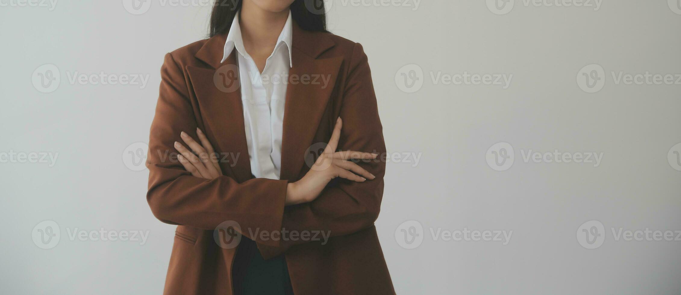 Asian Business woman using calculator and laptop for doing math finance on an office desk, tax, report, accounting, statistics, and analytical research concept photo