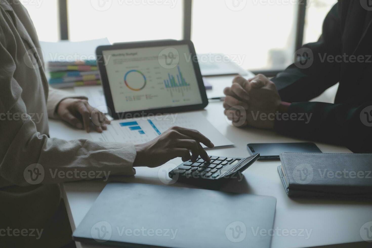 Audit concept,Administrator business man financial inspector and secretary making report calculating balance. Internal Revenue Service checking document. photo