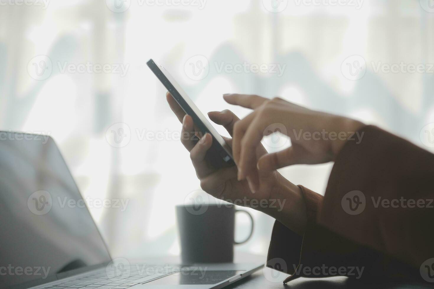 Asian Business woman using calculator and laptop for doing math finance on an office desk, tax, report, accounting, statistics, and analytical research concept photo
