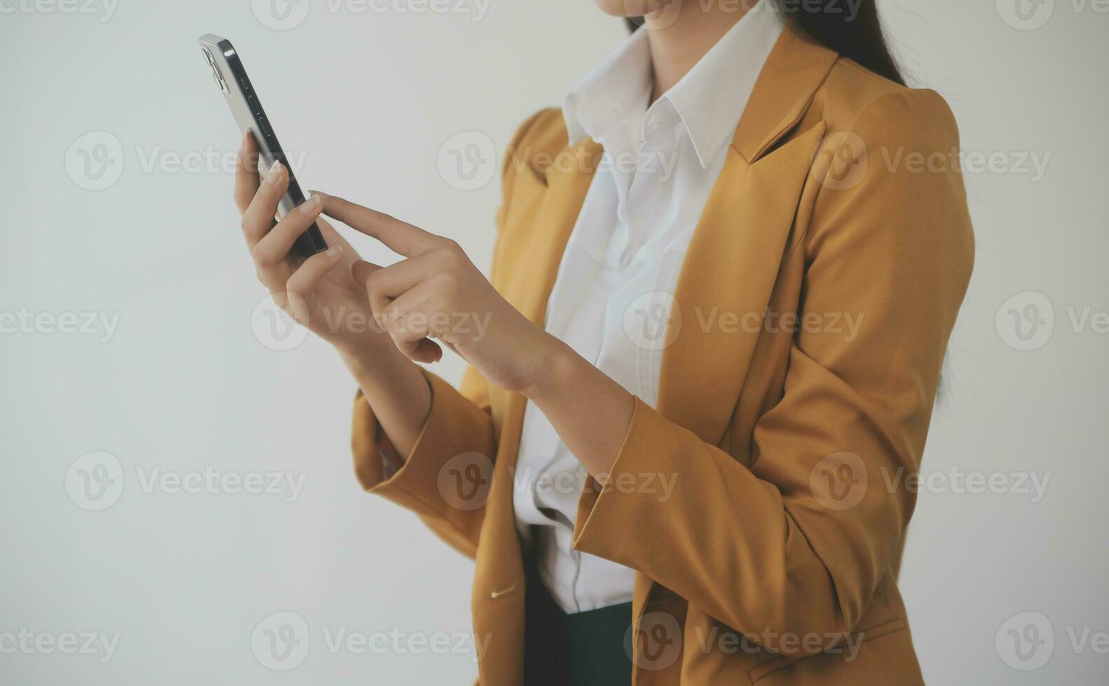 Asian Business woman using calculator and laptop for doing math finance on an office desk, tax, report, accounting, statistics, and analytical research concept photo