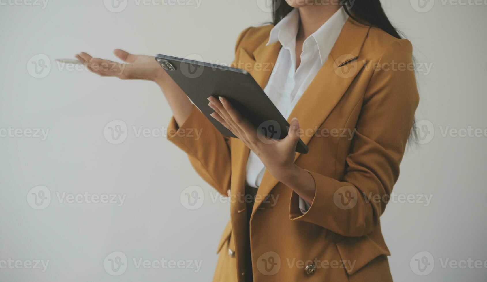 Asian Business woman using calculator and laptop for doing math finance on an office desk, tax, report, accounting, statistics, and analytical research concept photo