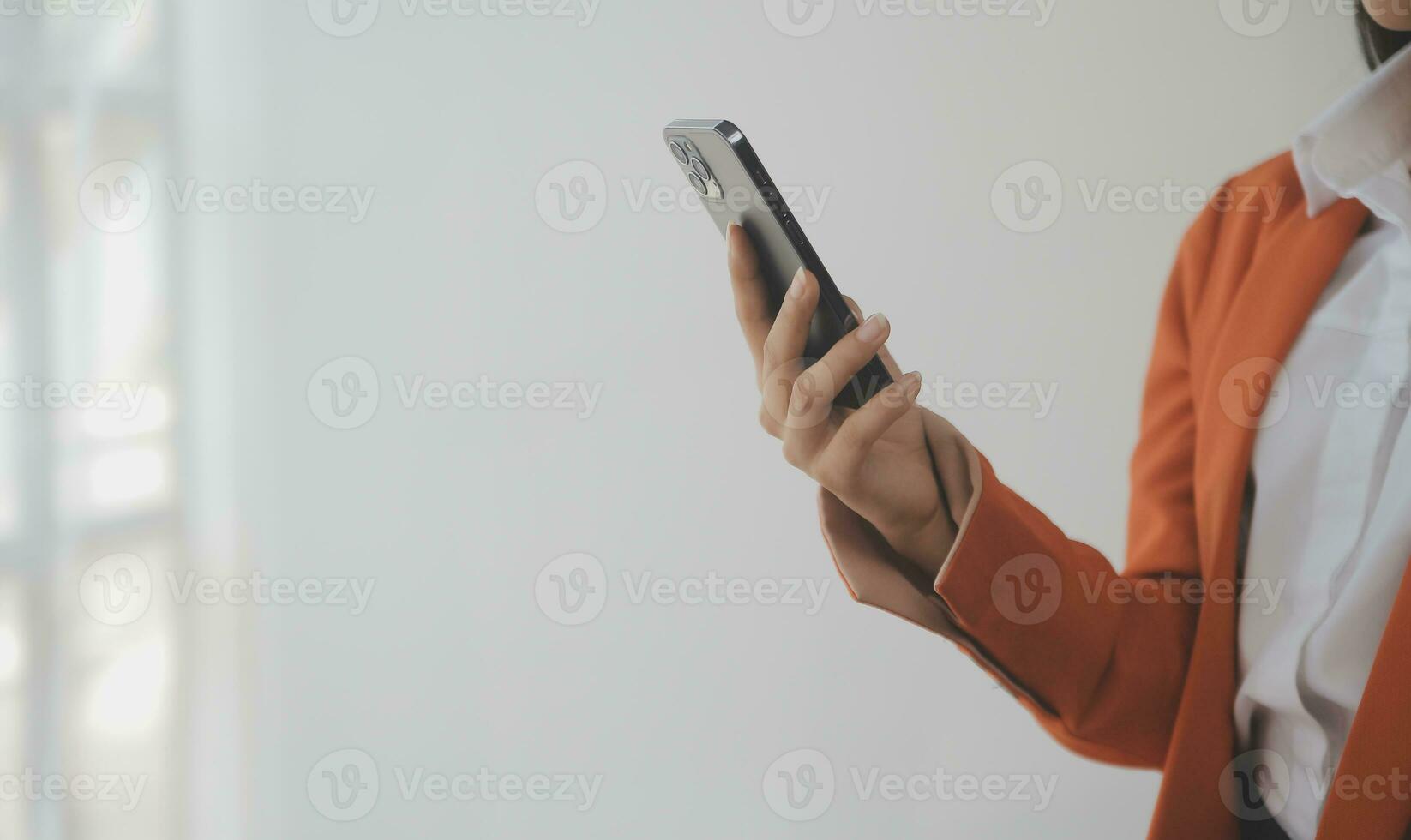 Asian Business woman using calculator and laptop for doing math finance on an office desk, tax, report, accounting, statistics, and analytical research concept photo