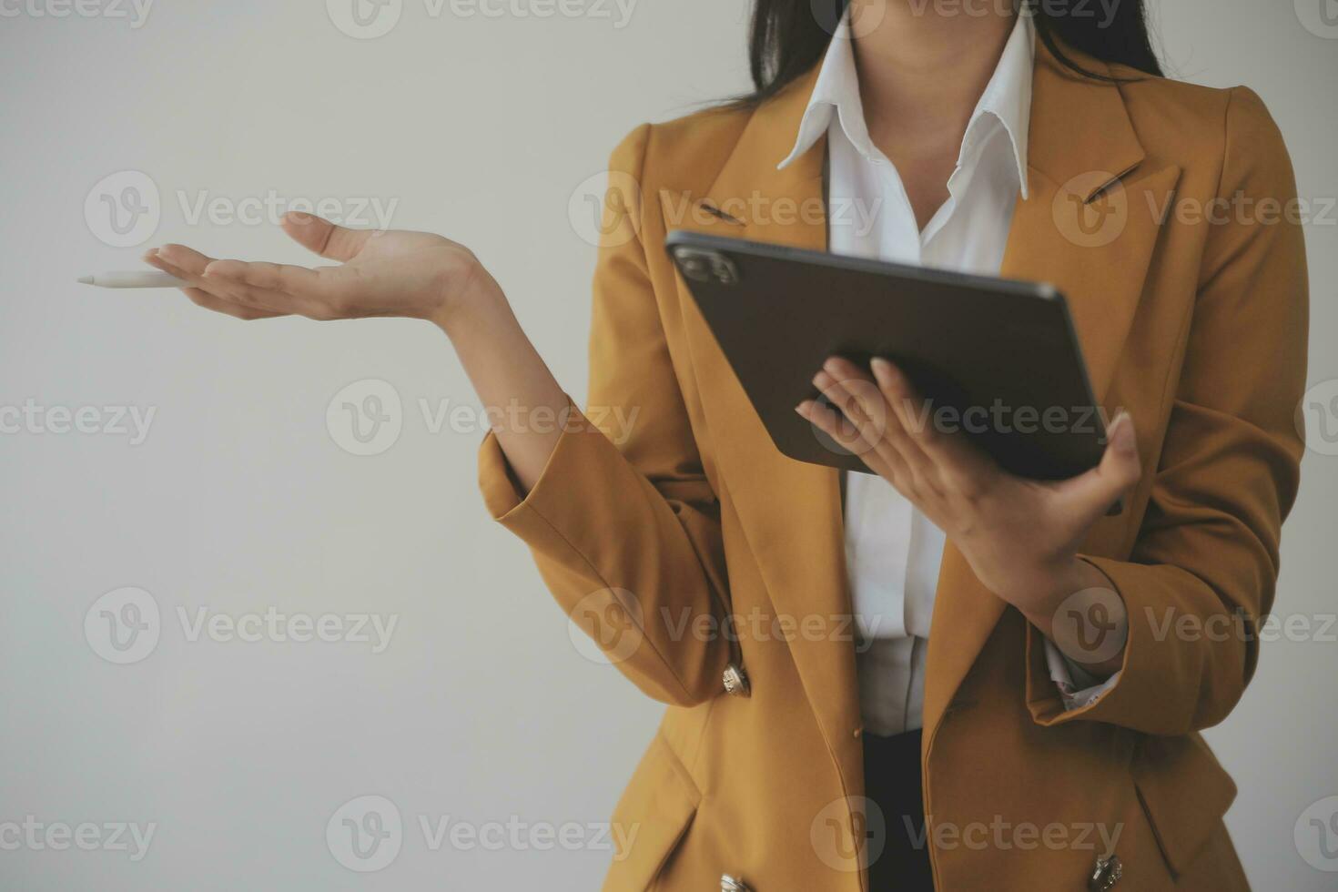 Asian Business woman using calculator and laptop for doing math finance on an office desk, tax, report, accounting, statistics, and analytical research concept photo