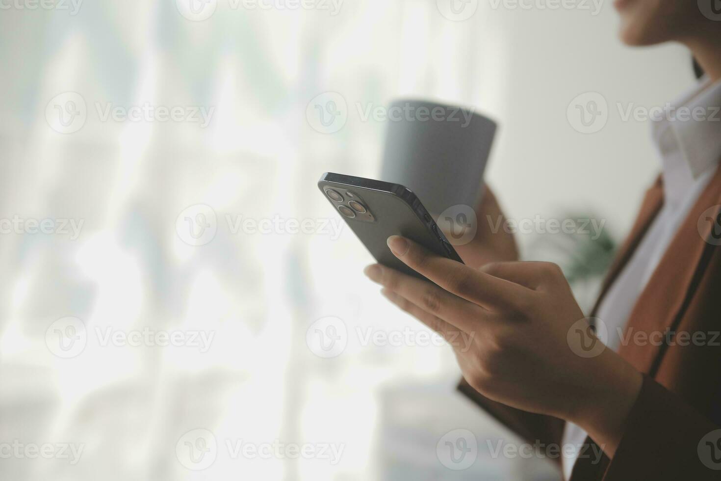 Asian Business woman using calculator and laptop for doing math finance on an office desk, tax, report, accounting, statistics, and analytical research concept photo