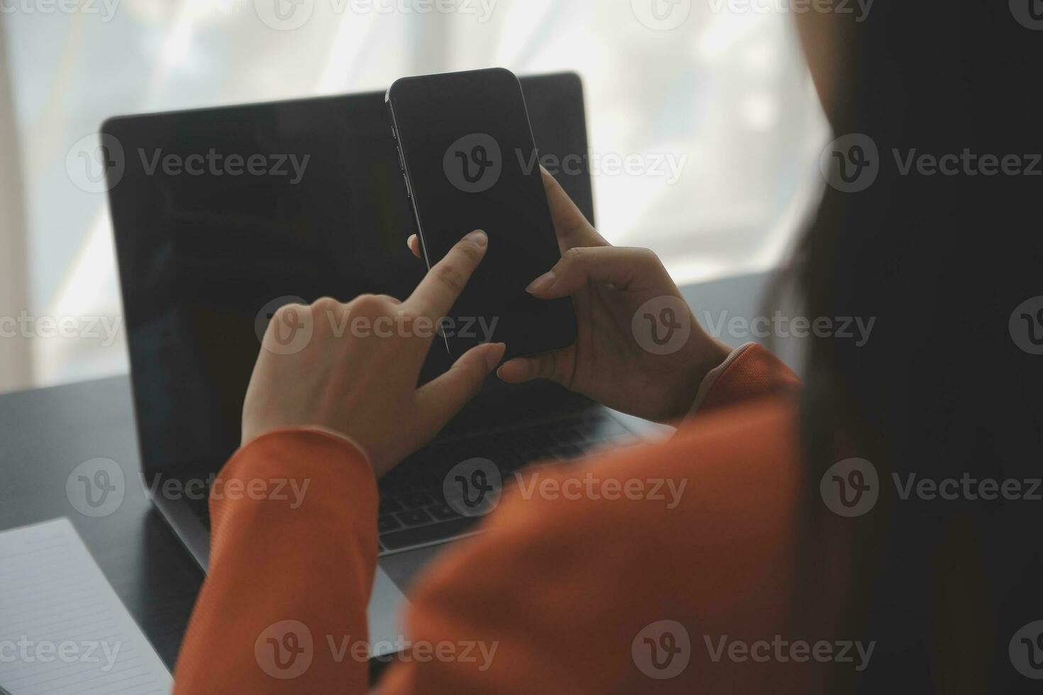 Asian Business woman using calculator and laptop for doing math finance on an office desk, tax, report, accounting, statistics, and analytical research concept photo