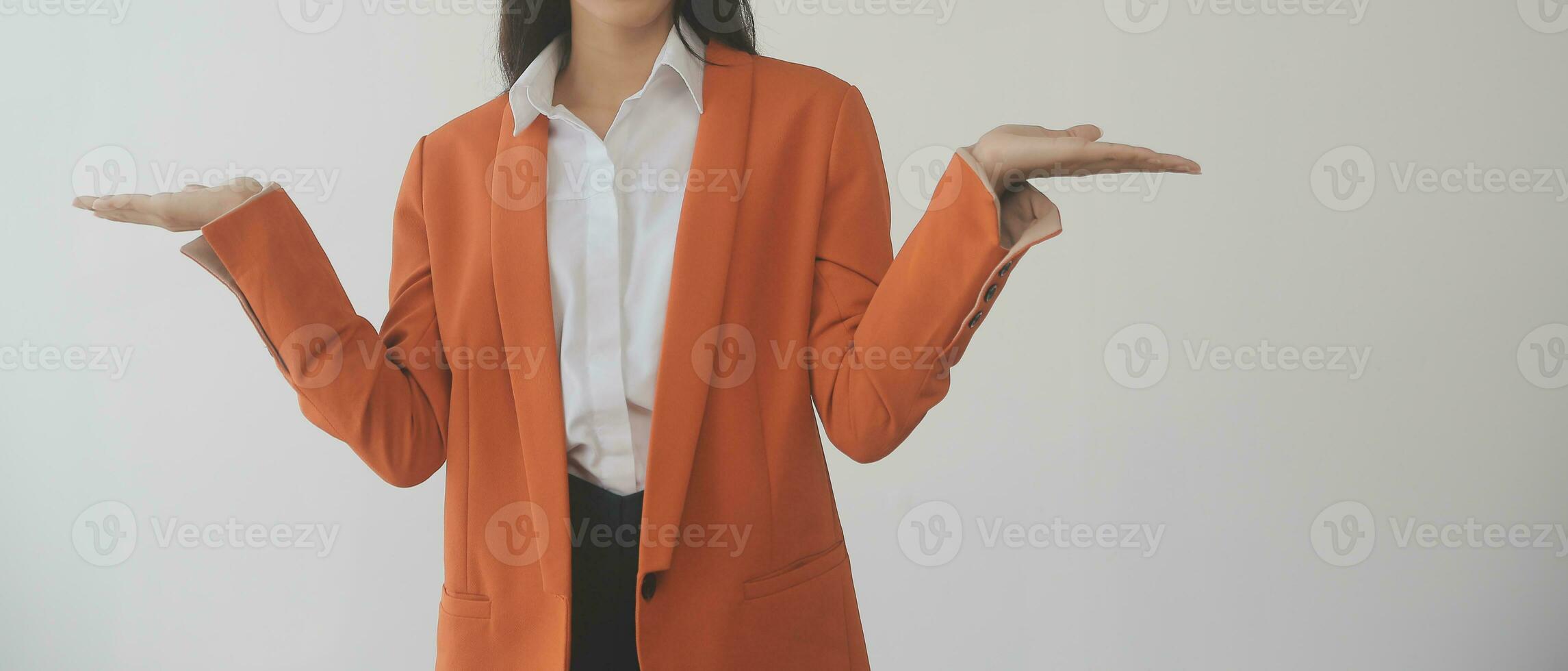Asian Business woman using calculator and laptop for doing math finance on an office desk, tax, report, accounting, statistics, and analytical research concept photo
