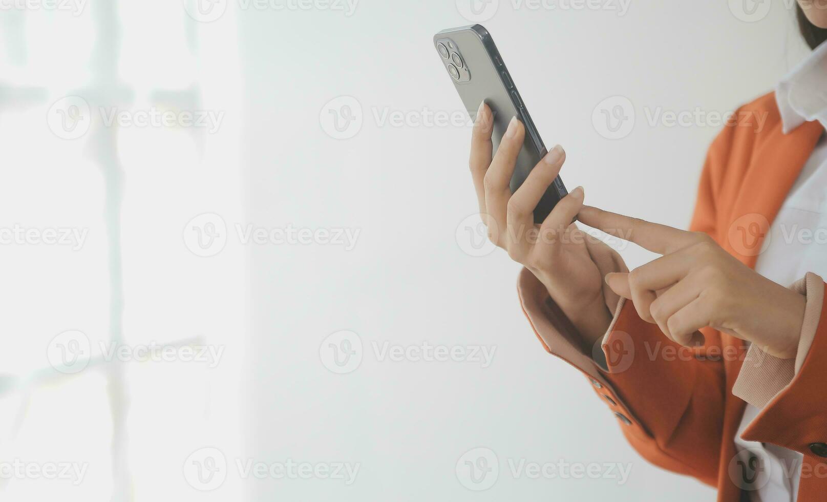 Asian Business woman using calculator and laptop for doing math finance on an office desk, tax, report, accounting, statistics, and analytical research concept photo