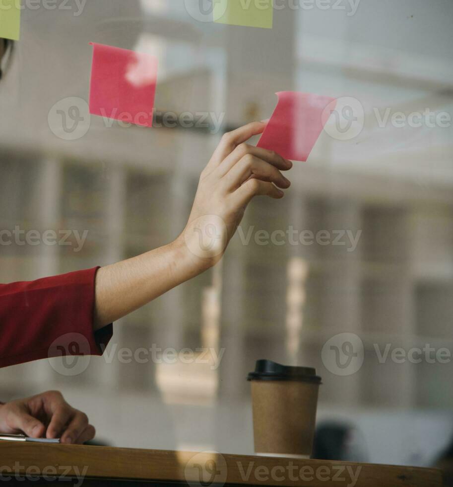 Close up of accountant working and analyzing financial reports project accounting with chart graph and calculator in modern office  finance and business concept. photo
