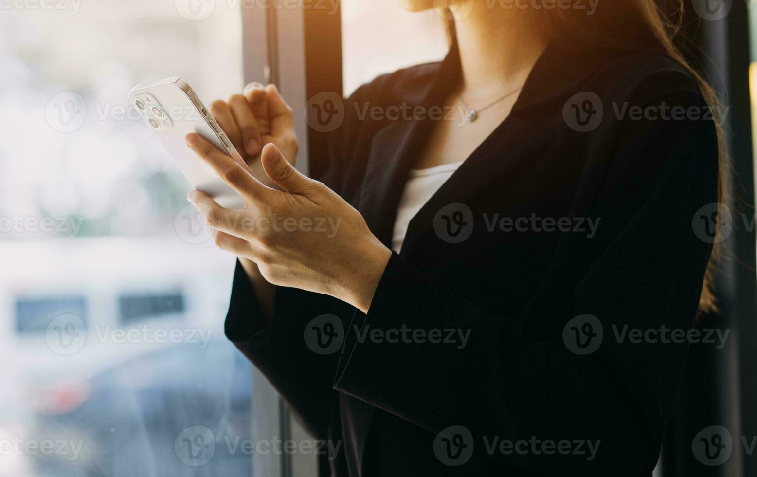 Asian Business woman using calculator and laptop for doing math finance on an office desk, tax, report, accounting, statistics, and analytical research concept photo