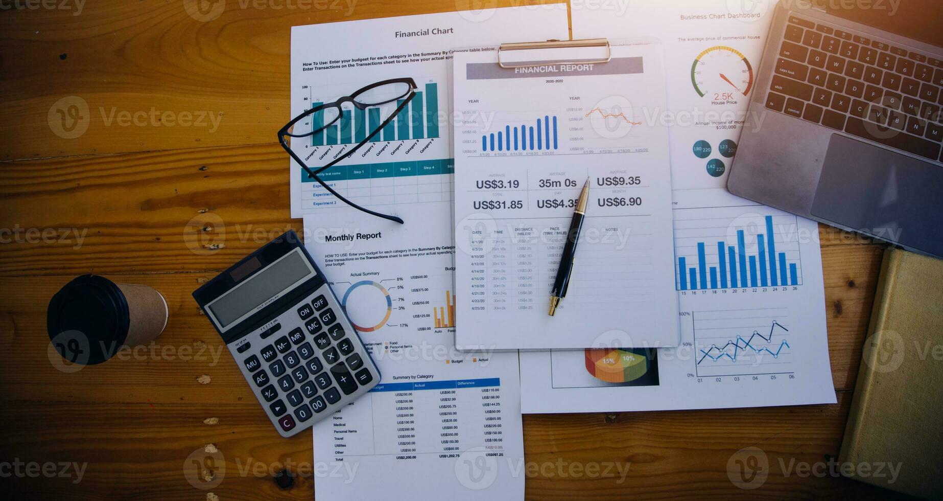 Asian Business woman using calculator and laptop for doing math finance on an office desk, tax, report, accounting, statistics, and analytical research concept photo