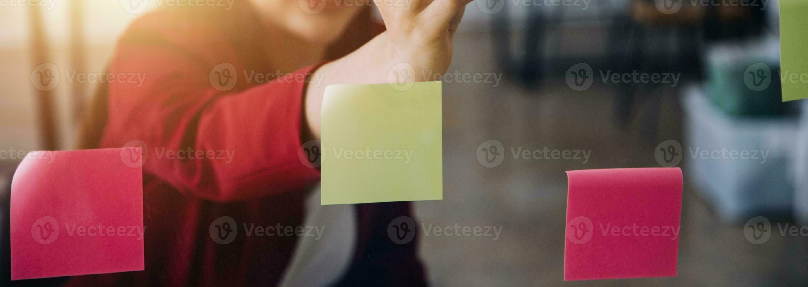Asian Business woman using calculator and laptop for doing math finance on an office desk, tax, report, accounting, statistics, and analytical research concept photo