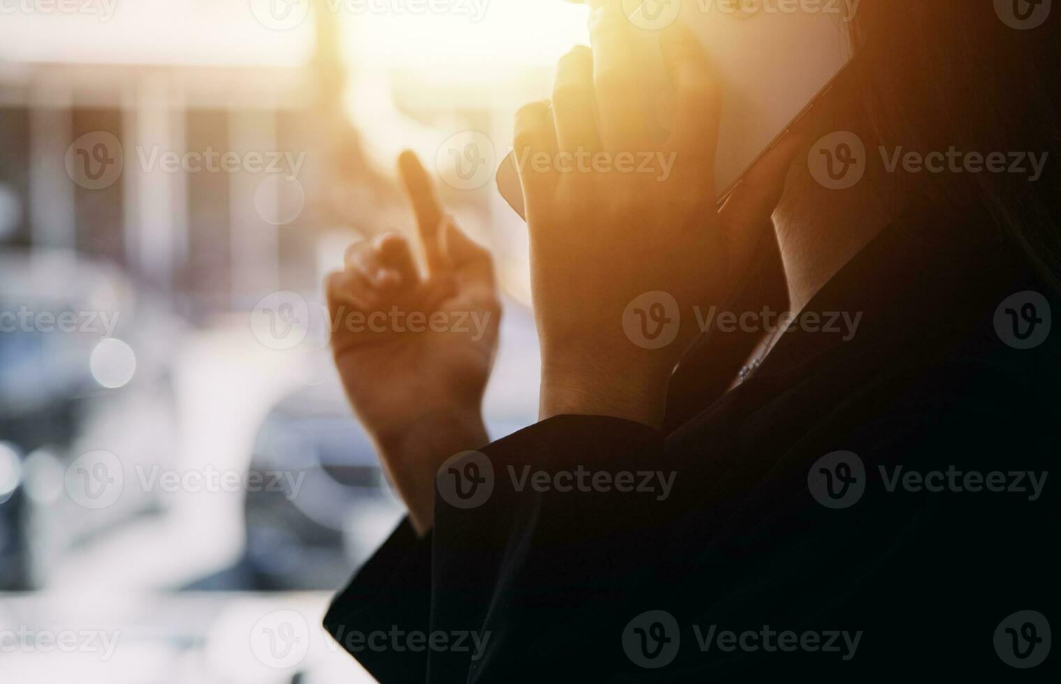 Asian Business woman using calculator and laptop for doing math finance on an office desk, tax, report, accounting, statistics, and analytical research concept photo